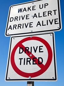 Drive alert, arrive alive road sign.
