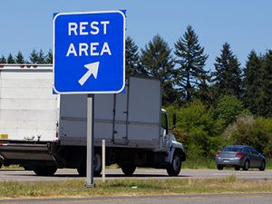 Rest area sign on highway.
