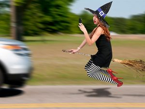 Witch texting while driving broom
