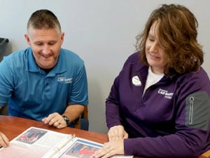 Christy Godsey-Price meeting with one of her General Managers.