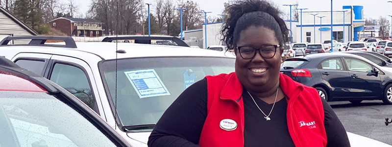 Jaqueeta Jones, Car-Mart Area Operations Manager, at a dealership.