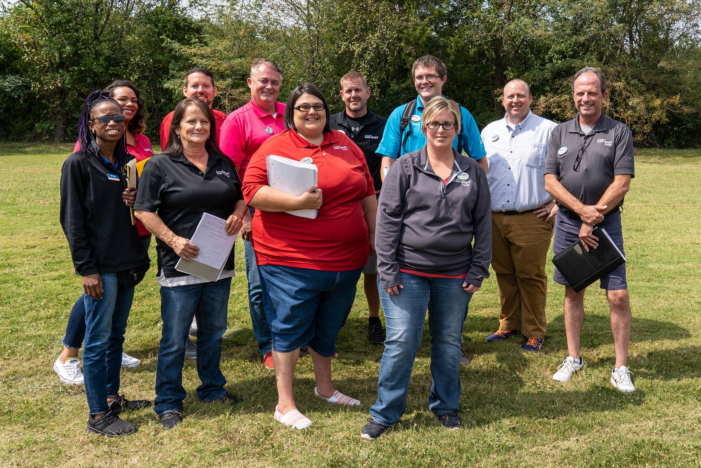 America's Car-Mart associates posing for picture