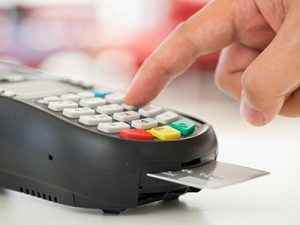 Building credit blog. Making payment on a credit card machine.