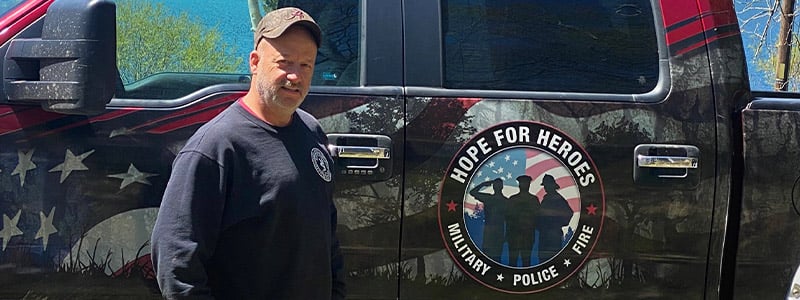 Mitch Serlin, founder of Hope for Heroes standing by his truck