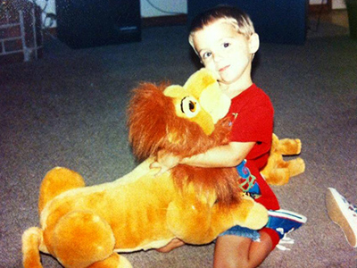Leon's son, Leo, with a stuffed toy lion