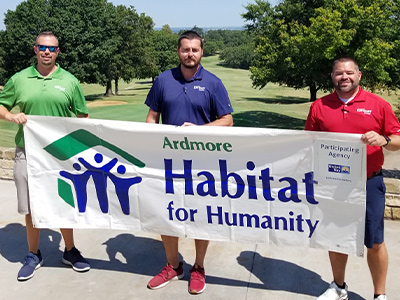 Travis with Laramie Caldwell and Josh Blancett at Habitat for Humanity