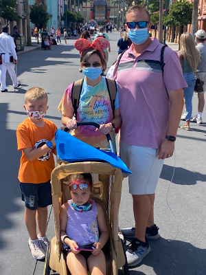 Travis with family at Disney World