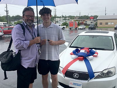 Will and his son at dealership after purchasing his Lexus