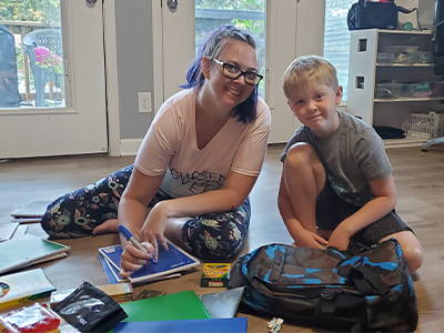 Josh's wife and son getting school supplies ready