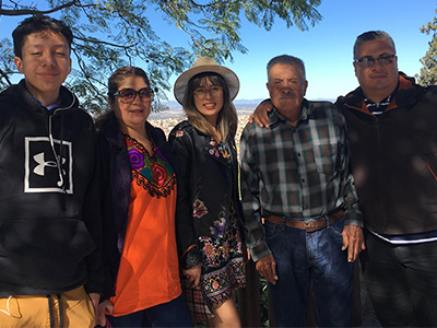 Alejandro "Alex" with his father, daughter, wife and son