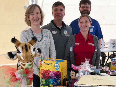 Car-Mart Associates dropping off toys