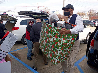 Car-Mart associates delivering toys