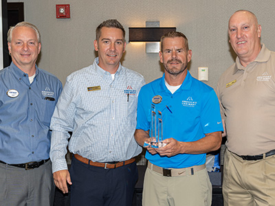 Curtis receiving Car-Mart's 2021 Mentor of the Year award. Pictured from left to right: Mike Ward, VP of Associate Support; Mike Rains, VP of Operations Region 1; Curtis Valentine; and Brian McFarland, Area Operations Manager