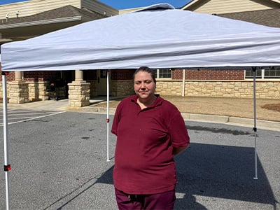 Denisha Bradford with the canopy tent she received from Car-Mart Woodstock