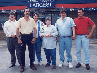 The original location of Car-Mart of Sapulpa. Circa 1993. Picture left to right are Dean Williams, Pat Melson, Gregg Carroll, Nan Smith, Bryan Adams, and Thad Shook