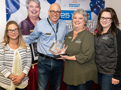 Lori (center right) with (from left to right) Jenny Marrero, Sr. Compliance and Audit Manager; Jeff Williams, CEO; Kristina Carpenter, Chief Compliance Officer