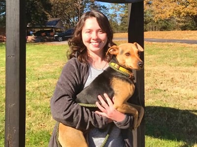 Brandi Blankenship, President/Director, Friends of Animals holding a dog