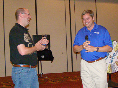 Barry receiving the President's Award in 2010 from then President and CEO Hank Henderson (retired)