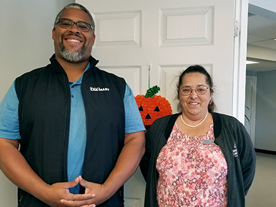 JoAnne with Reuben Jones, Manager at Car-Mart of Harrisonville, Mo.