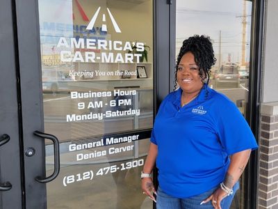 Denise Carver in front of the new Car-Mart of Evansville