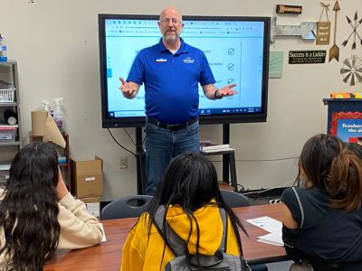 Barry Baggett, Senior Marketing Manager, teaching during a Junior Achievement class in Springdale, Ark.