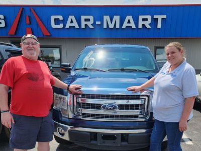 Allen Parish and Kaci Higgins, Sales Associate, with Allen’s Ford F-150