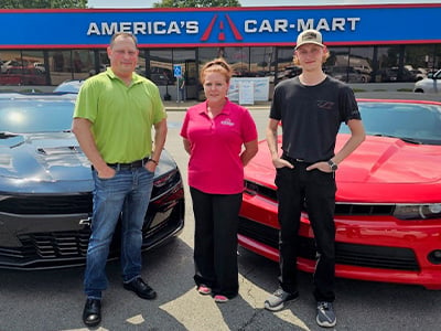 David and his son, Dawson, with Sales Associate, Heather Evans