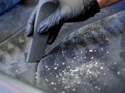 vacuum a dirty car interior