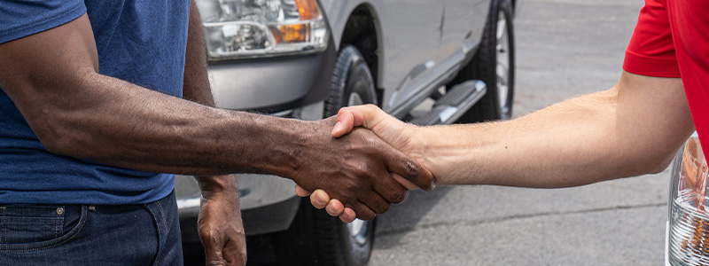 Car-Mart associate shaking customer's hand