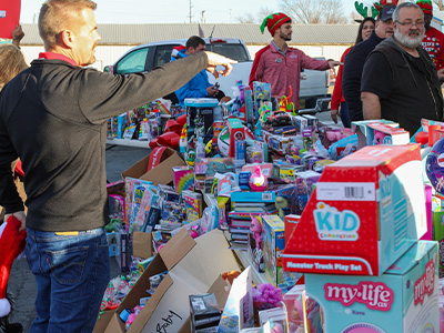 Rogers, AR dealership toy delivery.