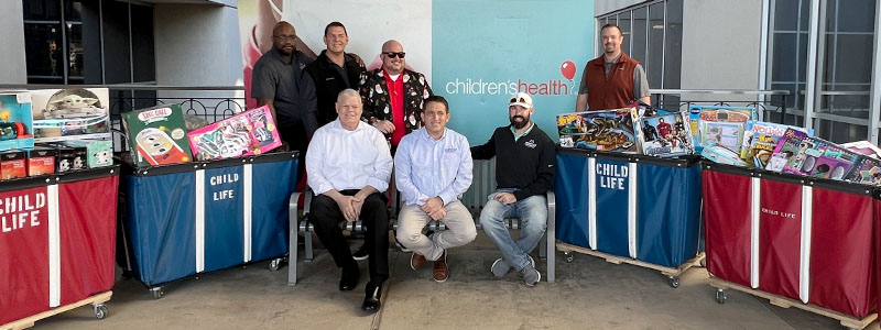 Car-Mart and OPENLANE associates delivering toys to Children’s Health in Dallas, Tx.