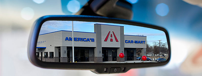 Car-Mart store in car rearview mirror