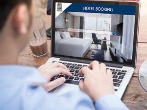 Man researching and booking a hotel online
