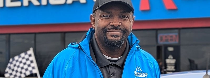 Dishawn Bell, general manager stands in front of the Car-Mart of Conway Arkansas dealership.